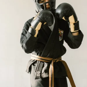 Martial artist wearing black protective training gear